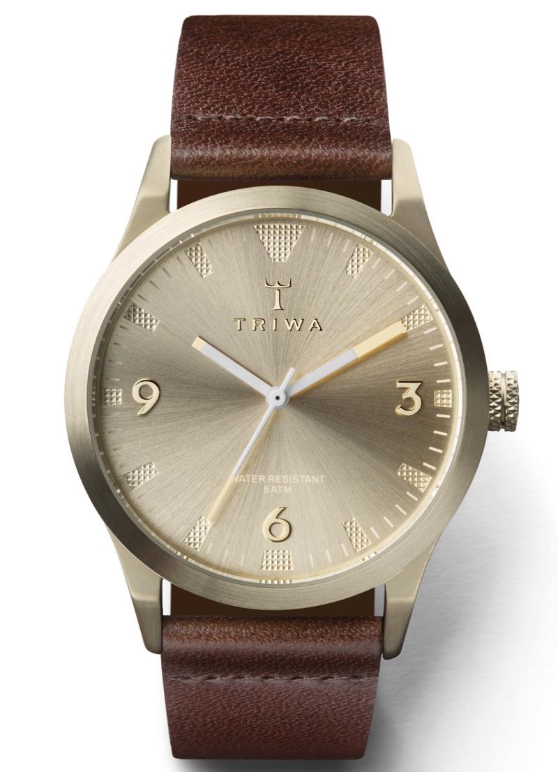 Guldfärgad klocka med två tillhörande armband Triwa Sort of Black